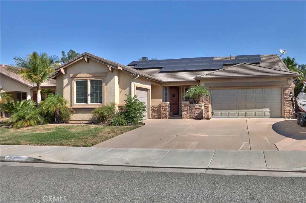 Come see what this 4 bedroom, 3 bathroom, single level, former MODEL HOME with upgrades has to offer, in the heart of Menifee! This home is the best of both worlds... In an HOA community BUT EXEMPT from CC&R's due to its status as a model home! Cash in on the new AIR CONDITIONER & HEATER (2023), tankless water heater (2022), and solar! This home also has a 3 car garage, room for RV and Boat parking, and no neighbors behind, with amazing firework shows every Independence Day! The backyard is finished with custom concrete work to include patio, seating, planter boxes, a SWIM SPA, and plumbed in gas fire pits for all types of gatherings! With an open concept and model home upgrades, this house shows well and has tons of room as a single level just under 2200 square feet and excellent curb appeal. A must see! Schedule your private tour today and be on the look out for open houses!