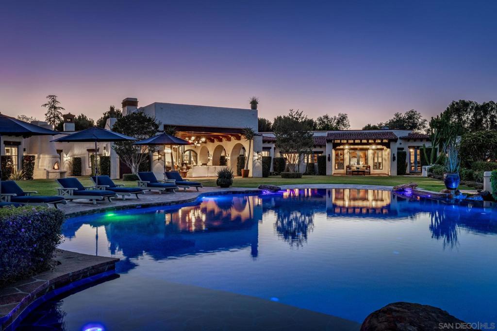 Priced just dropped! Buyer closed all cash in less than ten days! Spain, Morocco and Mexico unite in a 2017 custom built estate brimming with artisan touches! VIEWS, barn & arena, guest home, sport's court, and pool with 75-foot-long water slide on a sprawling 3.75-acres. Tucked behind private gates on one of the most coveted streets in Rancho Santa Fe Covenant, this palatial Spanish revival provides an opportunity to write your own story and live the dream in this spectacular estate! Meticulously built to perfection, this All One-Level estate features distinct detailing and grandeur, more-than-two-year transformation down to the studs featuring steel glass doors, carved-wood beams, and custom high-end designer lighting. Massive kitchen with wood hand-carved island and cabinetry, Monte Blanc quartzite countertops, and incredible custom Heston convection range combining three freestanding ranges. Formal living room offers indoor/outdoor living looking out to the impressive tiered infinite pool