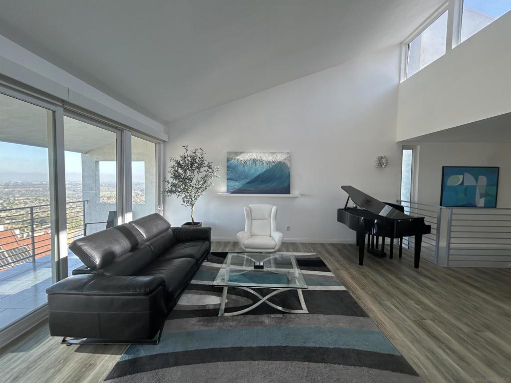 Modern luxury, panoramic views, and eco-conscious living come together in this fully remodeled showpiece perched in the gated community of Del Cerro Heights. Set high above the city, this home delivers jaw-dropping ocean and sunset views from one of Del Cerro’s most desirable locations—zoned for top-rated Hearst Elementary, Lewis Middle, and Patrick Henry High. Enter to soaring 15-foot vaulted ceilings, expansive windows, and an open-concept layout bathed in natural light. Automated blinds in the living room let you control light and privacy with ease. Every inch of the home has been thoughtfully renovated—nothing was left untouched. From the sleek, modern kitchen to all bathrooms, including a stunningly reimagined primary suite with a massive walk-in closet and spa-like en-suite, this home was designed for both comfort and style. Wide-plank luxury vinyl flooring flows throughout the space, tying each room together with warmth and elegance. An owned solar system supports energy-efficient living, while the oversized garage includes loft storage for all your extras. This gated community include a large pool, spa, tennis courts, gym, sauna and a park. This is more than a home—it's a lifestyle defined by design, sustainability, and unmatched views. Modern luxury, panoramic views, and eco-conscious living come together in this fully remodeled showpiece perched in the gated community of Del Cerro Heights. Set high above the city, this home delivers jaw-dropping ocean and sunset views from one of Del Cerro’s most desirable locations—zoned for top-rated Hearst Elementary, Lewis Middle, and Patrick Henry High. Enter to soaring 15-foot vaulted ceilings, expansive windows, and an open-concept layout bathed in natural light. Automated blinds in the living room let you control light and privacy with ease. Every inch of the home has been thoughtfully renovated—nothing was left untouched. From the sleek, modern kitchen to all bathrooms, including a stunningly reimagined primary suite with a massive walk-in closet and spa-like en-suite, this home was designed for both comfort and style. Wide-plank luxury vinyl flooring flows throughout the space, tying each room together with warmth and elegance. An owned solar system supports energy-efficient living, while the oversized garage includes loft storage for all your extras. This gated community include a large pool, spa, tennis courts, gym, sauna and a park. This is more than a home—it's a lifestyle defined by design, sustainability, and unmatched views.