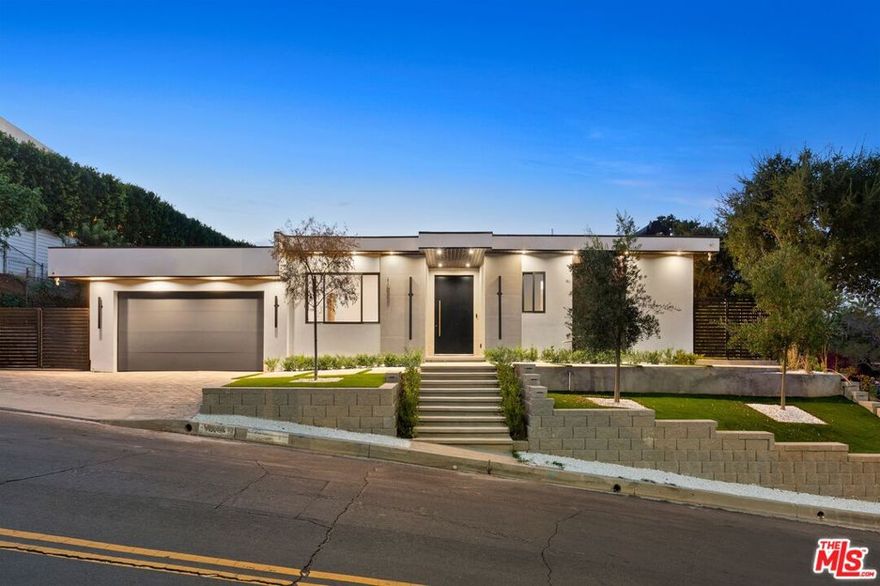 Perched in the coveted Encino Hills, this stunning single-level residence offers modern design, seamless indoor-outdoor living, and an unbeatable location with easy access to both the Westside and the Valley.Step inside to soaring ceilings, expansive glass doors, and an open layout that bathes the interiors in natural light. The living room features a striking contemporary fireplace wall, flowing effortlessly into the chef's kitchen adorned with custom wood cabinetry, stone countertops, and top-of-the-line appliances. Skylights and oversized windows create an airy, inviting atmosphere throughout.The primary suite is a retreat of its own, complete with a spa-like bathroom boasting dual vanities, a soaking tub, and an oversized walk-in shower framed in luxe stone. Additional bedrooms and bathrooms offer comfort and flexibility for family, guests, or work-from-home needs.Outdoors, a sparkling pool and spa set the stage for resort-style relaxation. A sleek covered bar and lounge area make entertaining effortless, while the generous patio spaces encourage al fresco living year-round.With its modern finishes, elegant single-level design, and exceptional location, this Encino Hills lease is a rare opportunity to enjoy California living at its finest.