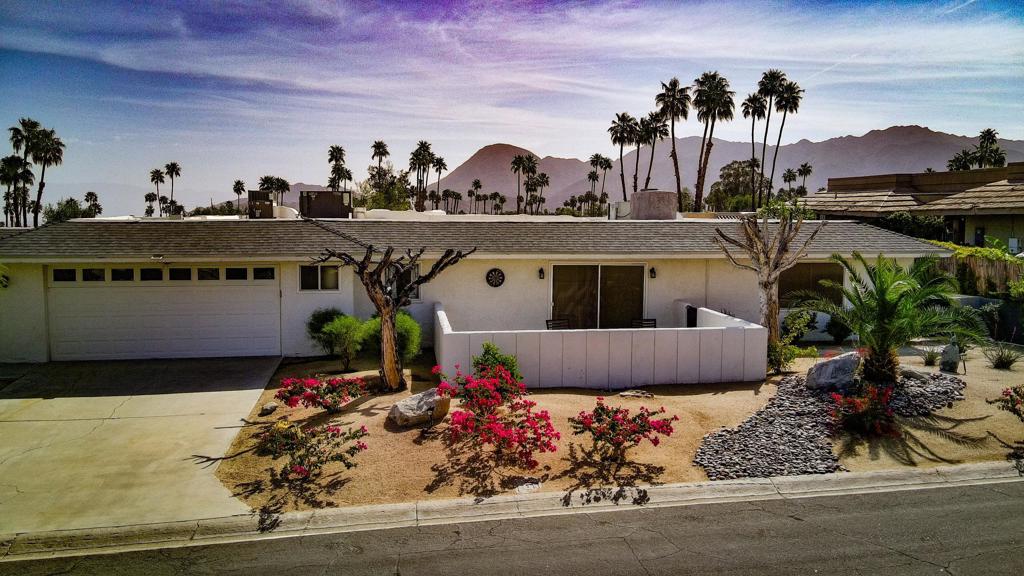 South Palm Desert with unparalleled WRAPAROUND, ELEVATED VIEWS of the mountains and city below. Patio spaces surround the home and face all directions with stunning scenery. The primary suite and first large family room are located on the North side of the home while the other 2 bedrooms, and EXTRA FAMILY ROOM are on the other side, separated by the open kitchen, dining area and contemporary 2-sided fireplace. Everyone has plenty of their own space in the home and every room has direct access to the pool and spa. The primary bathroom has been extensively updated and the entire property has been meticulously maintained and upgraded over the years. The pool/spa have NEW EQUIPMENT, and the plumbing and electrical have been upgraded within the home. The spacious property boasts views, privacy, NO HOA dues, multiple HVAC zones, and a private pool and spa featured in the center of the home. Don't miss this jewel that's been rumored to be a vacation retreat to stars and dignitaries that also happens to be right up the road from the world famous El Paseo, call today!