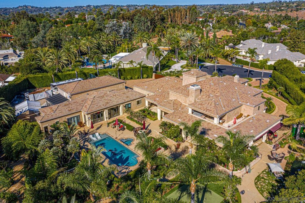 Spectacular Gated Estate with rare Guest House with Dual Bay Motor Coach Villa. Renovated over the past 10 years, this residence was designed with highest level of form and function in mind. The estate features a gourmet & full prep kitchen well-appointed with high grade appliances, designed for entertaining at a High Level, all Bedrooms are ensuite, Gorgeous Master Bedroom,with Elevator, Large Balcony, w/Spa, his and her vanities, Dual Closets, Steam Shower. 2BD Single Level Guest House w/Kitchen, Dual Master Suites. Solar System. For the car or RV enthusiast the motor coach villa could be an indoor sports court as well, home has large solar system and pool solar system with plenty of storage. A rare compound set on a flat 1.51 acre lot, a mature botanical garden of specimen palms, citrus, fruit and other rare tropical plants. Over 10,000 square feet of indoor and outdoor entertainment spaces, covered/heated loggias. Gated Estate with exceptional manicured grounds and rare dual bay motor coach villa/guest house. Renovated over the past 10 years, this thoughtful residence is designed with an Anglo Caribbean architectural style set on a cul-de-sac. The main home features both a gourmet and full prep kitchen appointed with all high grade appliances and detail, perfect for servicing large events. Upgraded elevator, multiple ensuite bedrooms and a generous master bedroom/bathroom suite with large balcony w/spa, dual walk in closets, crystal chandeliers, and steam shower. Full outdoor kitchen set under the covered loggia with views of the grounds and living pond, Well prepared for indoor and outdoor events, the spectacular guest house with full kitchen and wine storage also includes two generous ensuite bedrooms. A gated motor court with limo depth 4 car garage and room for boats/trailers. For the car or RV enthusiast the motor coach villa could be an indoor sports court as well, home has large solar system and pool solar system with plenty of storage. A rare compound set on a flat 1.51 acre lot, a mature botanical garden of specimen palms, citrus, fruit and other rare tropical plants. Complex Features: ,,,,, Equipment: Fire Sprinklers,Garage Door Opener,Pool/Spa/Equipment, Shed(s) Sewer: Sewer Connected Topography: LL Guest House Est. SQFT: 2098