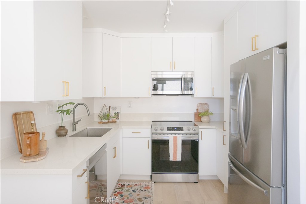 Rarely do you find a remodeled 2-bedroom, 2-bathroom condo priced this low just blocks from the beach! A rare opportunity in the coveted Seacrest community of South Redondo. Light, bright, and thoughtfully updated, the unit features new bathrooms, a brand-new kitchen with quartz countertops, new cabinetry, and laminate flooring throughout. Single-level living adds to the ease, and the parking space is just steps from your front door, offering a level of convenience that feels more like a single-family home! The Seacrest community consists of only 16 units and offers charming mid-century appeal enhanced by modern updates. Residents enjoy access to a sparkling pool, secured storage for bikes and beach gear, and a community laundry room. Located just a block from Torrance Beach and minutes to the shops and restaurants of the Hollywood Riviera, this is your chance to live the coastal lifestyle in one of South Redondo's best-kept secrets.