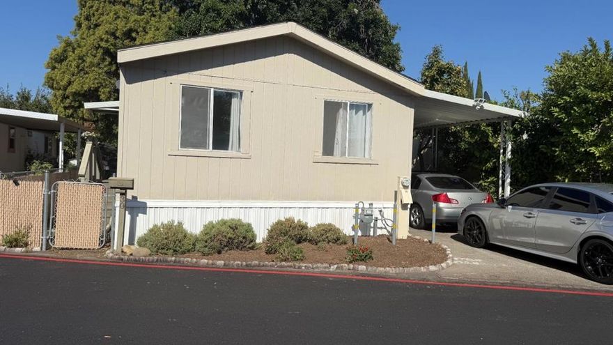Explore this charming 1994 Double wide home. The home is move in ready. 2 Bedroom 2 Bath has a nice living room with separate dining area. laminated floors throughout the home. Nice master bedroom with master bath. The utility room include's washer and dryer. The appliance's are included black and stainless steel. Additional amenities central heating. This home is conveniently located near freeway 87/101 and shopping centers. 1 shed and fenced in yard. A must see