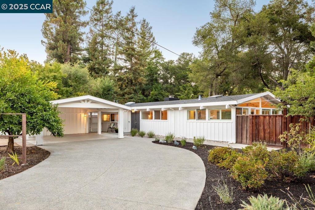 The Del Rey area is a beehive of family activity, with couples walking the flat neighborhood with their dogs, or with children to school. This home, on a quiet cul-de-sac, is just a 4-minute walk to Del Rey Elementary, and less than a mile to Orinda Intermediate and Miramonte High. Enter the home to a foyer; the open-concept living area lies ahead, over Brazilian cherry hardwoods. The dining area and family/living room flow seamlessly into each other. The area comprises 577 sq ft of living space in all, under a peaked beamed ceiling, with a wood-burning fireplace alongside. The well-appointed kitchen sits nearby, with quartz counters and island, top appliances from Miele and Dacor, and a nearly new range. Louvered shutters, skylights, and oversized windows invite in natural light and offer views of oaks (the street name, “Encinas,” is a reference to the neighborhood’s prevalent oak trees), bamboo, redwoods, and other mature foliage. The stone deck provides more views of nature and ample entertainment space. The 3 bedrooms are down the hall. The principal suite is more than 300 sq ft in size, with a large walk-in closet and remodeled en-suite bathroom. Work or study from home is easy in the detached 210-sq-ft studio. Gardens and pergolas surround the home.