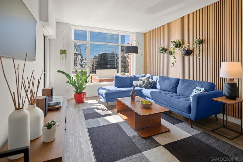 Absolutely delightful and meticulously maintained 1-bedroom condo with balcony at Diamond Park Terrace, located in the heart of East Village, with amazing views into Petco Park. Move-in ready and offered turn-key, this stylish home presents a bright open floor plan with wood flooring, a beautifully updated kitchen featuring ample cabinetry, counter space, and stainless appliances. The spacious bedroom showcases downtown views, a walk-in closet with custom shelving, and a roomy bath with dual access. The home also features an art frame TV and an in-wall safe for added security and convenience. Enjoy one secure gated parking space plus a separate storage unit. Community amenities include a rooftop terrace with spectacular views into Petco Park’s “Baseball Diamond,” fitness center, lounge, and BBQ areas. Live steps from Petco Park, the Harbor and Marina, the Gaslamp Quarter, Little Italy, and world-class dining, shopping, and entertainment. A unique opportunity to own a turn-key property in a prime location.
