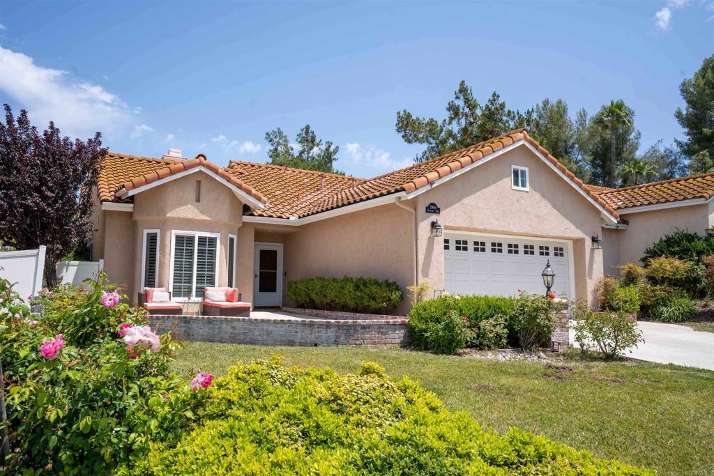 Beautifully updated 3-bedroom, 2-bath gem in the coveted community of Roripaugh Hills. This home features rich hardwood floors, crown moulding, plantation shutters, dual-pane windows, and custom touches throughout. With an owned solar system, it’s as efficient as it is inviting! At the heart of the home, the kitchen and dining area glow with west-facing light and sunset views. You'll find custom maple cabinetry, quartz countertops, stainless steel appliances, a subway tile backsplash, and cozy window seating. The master suite includes a built-in office nook, unique brick flooring, and an updated bath with a quartz vanity, glass shower, and sconce lighting. The guest bathroom features travertine tile and a custom shower. Step outside to a peaceful backyard with custom concrete, vinyl fencing, a shed, and your own lemon tree. Additional highlights include a converted attic bonus room with extra storage and an insulated two-car garage. Just steps from the community pool, spa, and sports courts, and zoned Temecula Unified schools—with wine country only minutes away—this is the one you’ve been waiting for!