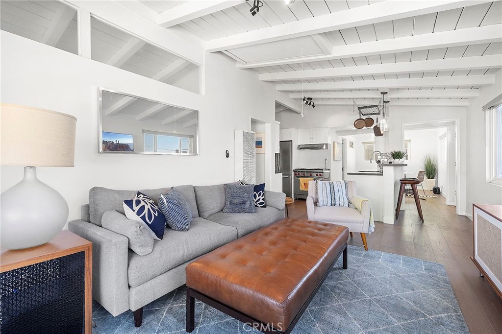 Less than half a block from the sand in the highly sought-after Manhattan Beach Sand Section, this beautifully remodeled duplex offers the ultimate coastal lifestyle. With stunning ocean views from throughout the property, a stylish modern design, and an unbeatable location, this is a rare opportunity in one of Manhattan Beach’s most desirable neighborhoods.
The upper unit is a spacious and light-filled 2-bedroom, 2-bathroom perch, where you can take in the ocean breeze and picturesque views. The lower unit is a tranquil 1-bedroom, 1-bathroom space that opens to a private yard/patio—perfect for entertaining or relaxing after a day at the beach. Both units have been thoughtfully upgraded inside and out, blending contemporary finishes with beachside charm, and each includes its own washer and dryer for added convenience.
Whether you're looking for a dream beachside home with an income opportunity, a prime investment in a thriving rental market, or a future build site in an unbeatable location, this property offers endless potential. Just steps from the sand and moments from the vibrant North Manhattan Beach dining and shopping scene, as well as a short ride to Downtown Manhattan Beach’s upscale amenities, this is coastal living at its finest.