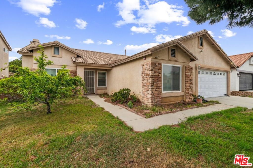 Now available for lease, this spacious 4-bedroom, 2-bathroom single-story home offers comfort, convenience, and charm in the heart of Rialto. With over 1,200 square feet of interior space, the residence features a welcoming open layout ideal for modern living. The updated kitchen showcases sleek dark cabinetry, stainless steel appliances, and a large center island perfect for meal prep or casual dining. Adjacent dining and living areas are flooded with natural light and include vaulted ceilings and a cozy fireplace that enhance the sense of space and warmth. Each bedroom is well-sized and includes generous closet space, while the primary suite offers direct access to the backyard. Additional highlights include tile and wood flooring throughout, central air and heat, recessed lighting, and an attached two-car garage. The private backyard is ideal for relaxing or entertaining with ample room to enjoy outdoor living. Located in a peaceful residential neighborhood near parks, schools, and shopping, this home blends comfort and functionality perfect for anyone seeking a turn-key lease opportunity.