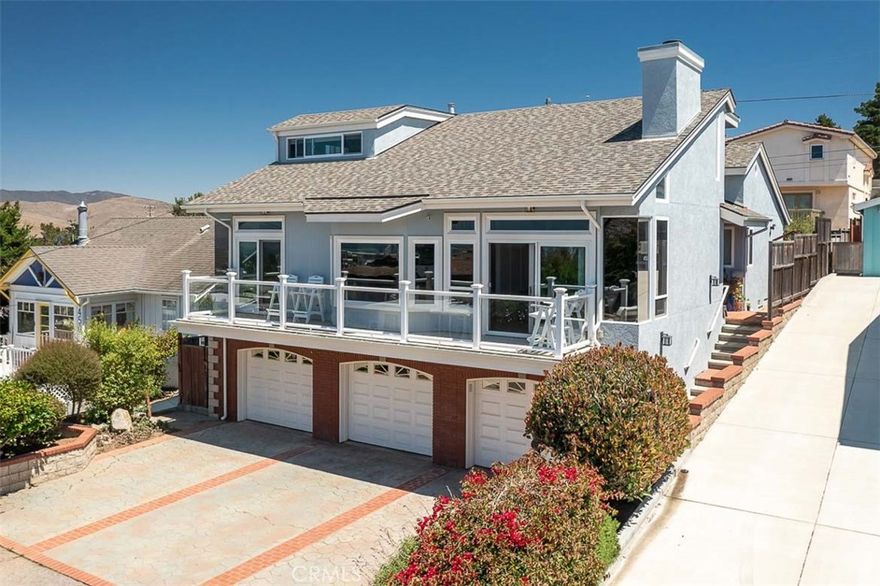 Enjoy iconic views of Morro Rock and out to the Pacific from this fully renovated, move-in-ready home in prestigious Morro Heights. With 4 bedrooms, 2.5 baths, and 2,904 sq. ft. of thoughtfully designed living space, every detail has been upgraded—no expense spared. The main-level primary suite offers a spa-like bath with heated floors. A chef’s kitchen with top-of-the-line appliances including a 5 burner induction cooktop opens to the dining and living areas, where an artfully tiled fireplace and walls of windows frame the breathtaking views. Just beyond, a deck off the main living space provides a perfect perch for taking in the scenery.The home also features a generously sized family room, ideal for movie nights or gatherings, as well as a sunroom overlooking the backyard that makes a perfect reading nook or flexible bonus space. 3 good sized upstairs bedrooms with well-appointed family bath with radiant heated floors. With new windows and mechanical systems, a 3-car garage, and a beautifully landscaped backyard, LED-lit front deck with automatic dusk-to-dawn lighting, this turnkey home on a quiet street with nearby hiking trails and public golf course combines modern comfort with timeless coastal charm.