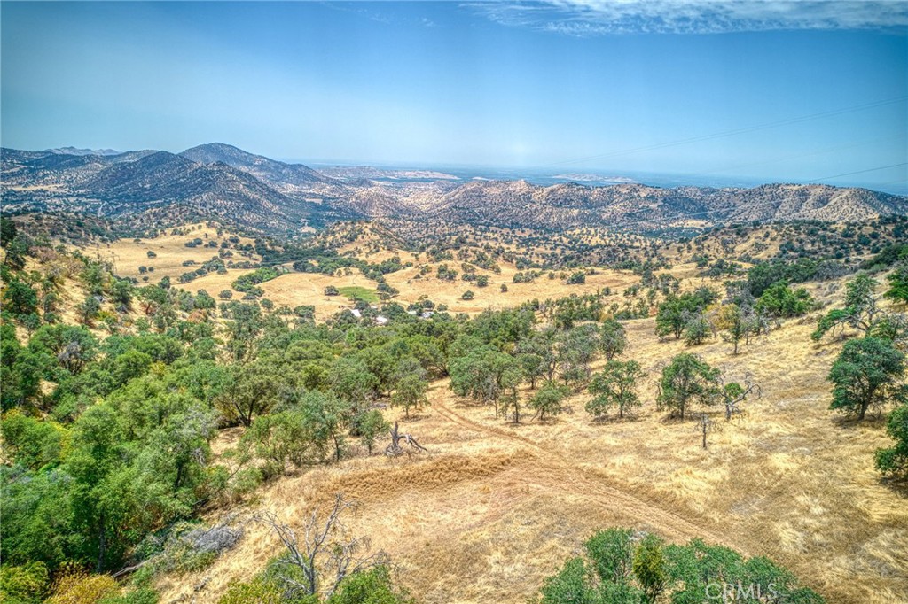 This is almost a 5 acre lot with road access! Truly something you need to see to believe! Check it out and you can build on it, keep it for a long time and then build! Great views and all!