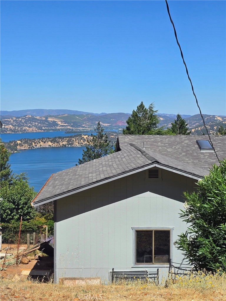 Lakeview property located in the very desirable Riviera West area of Kelseyville. Residents of this community enjoy the swimming pool, the picnic area, the private boat launch, boat dock, club house and far more! This home has a fantastic view of the water. Two covered decks upstairs and downstairs, 3 bedrooms all with walk in closets. A nice kitchen with ample cabinet space. The home has a 2 car garage and a nice sized driveway.