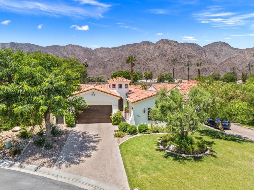 This is the perfect desert retreat for those seeking luxury, convenience, and an un-beatable lifestyle. Featuring 4-bedrooms with separate 2-room casita nestled on a premium lot along the golf course in the gated community of Haciendas at La Quinta. This architecturally refined home offers the ultimate in elevated desert living, with sweeping views of the golf course and surrounding mountains, creating a breathtaking backdrop. The heart of the home is a gourmet chef's kitchen, thoughtfully designed. Outfitted with top-of-the-line designer appliances, including a Sub-Zero refrigerator, wine storage, Wolf range. The Custom cabinetry has glass features and pull outs, Premium Calacatta Quartz jumbo slab countertops, and a large island provide both elegance and function, with all new lighting. This space is ideal for entertaining or intimate gatherings! Each space within the home reflects attention to detail. with high-end luxury finishes, custom built-ins, window treatments, and designer touches throughout. The great room open-concept living seamlessly connect indoor and outdoor spaces, with vaulted ceilings, wood beams and a cozy fireplace. Step outside to your own private resort-style oasis, featuring a salt water pool, spa, firepit, built in BBQ, and panoramic vistas of the lush golf course and majestic mountains. Other features of this home are the Primary bedroom with a king sized bed and views to the beautiful backyard, the primary bathroom has a large walk in shower and soaking bathtub with dual vanity sinks. Primary walk in closet with custom built in features, The guest bedroom on the opposite side of the home has complete privacy and features a Queen bed and its own private remodeled en-suite. The Den which flows off of the kitchen is a great work from home-office and has French- Doors for total elegance. The Separate 2-room casita features a living area, en-suite, and a separate bedroom with another King sized bed, Coffee Bar area with microwave & refrigerator. This Home is Ideally located in the heart of La Quinta, walk or bike to Charming Old town LQ, The famous La Quinta Resort & Spa, close by are world -renowned golf courses, top-rated restaurants, & vibrant entertainment, hiking and biking trails are just minutes away. And for shopping visit the famous El Paseo shopping and entertainment district. Call me for a private showing of this luxurious vacation escape.Available Fall 2025 and Season 2026!