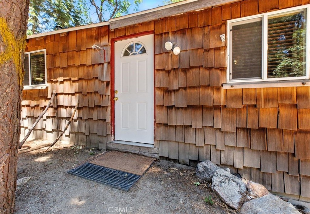 Escape to the tranquility of Palomar Mountain at 22166 Crestline Rd! This charming one bed room, one bathroom cabin offers 736 square feet of cozy living space and is the perfect retreat for nature, lovers, weekend warrior, or anyone craving peace and simplicity. Stay warm through crisp mountain nights with the efficient wood-burning stove. Led on just under an acre of serene, wooded land, you'll enjoy privacy, fresh air, and the sounds of nature all around you. Whether you're looking for a weekend getaway or a full-time escape from city life, this mountain gem won't last long, schedule your tour today!