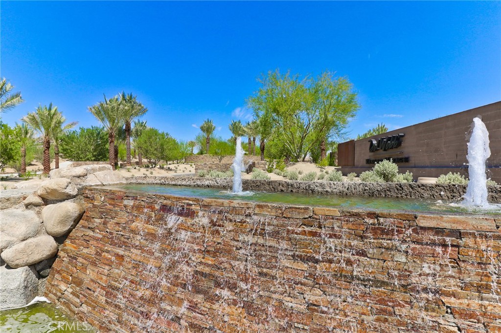 Welcome to 77 Syrah located in the gate guarded community of Del Webb Rancho Mirage. This is a 55+ senior community. Home was built in 2018 with SOLAR and tankless water heater. 2 bedrooms plus a den, 2 baths, 2 car garage, 2 covered patios. Ring door bell and exterior cameras. Electrical vehicle charger in garage. New light colored carpet. Open and airy kitchen with granite countertops, Whirlpool stainless steel appliances including new stainless steel stove, microwave, dishwasher, refrigerator and garage refrigerator. Kitchen has a large pantry. Some more features include fireplace, 3 ceiling fans, walk-in shower in primary bathroom, walk-in closet in primary bathroom, full size interior laundry room with new washer/dryer included. 2 new professionally mounted flat screen tv's in living room and master bedroom. Beautiful backyard landscaping with gardener included. There is currently indoor furniture and patio furniture that can stay or be removed. World-Class amenities to enjoy with close proximity to top shopping, dining, golf and recreation. 20,000-square-foot recreation center features a world-class fitness center and group fitness studio, resort-style pool with lap lanes and a spa. You can also play pickle ball, bocce, and tennis, or hike and bike on many of the beautiful trails in the greater palm springs area. The Westin Golf Resort And Spa is across the street. Enjoy the shows at Agua Caliente Resort Casino & Spa also just across the street. Excellent credit required with scores above 750 with reserves in the bank.