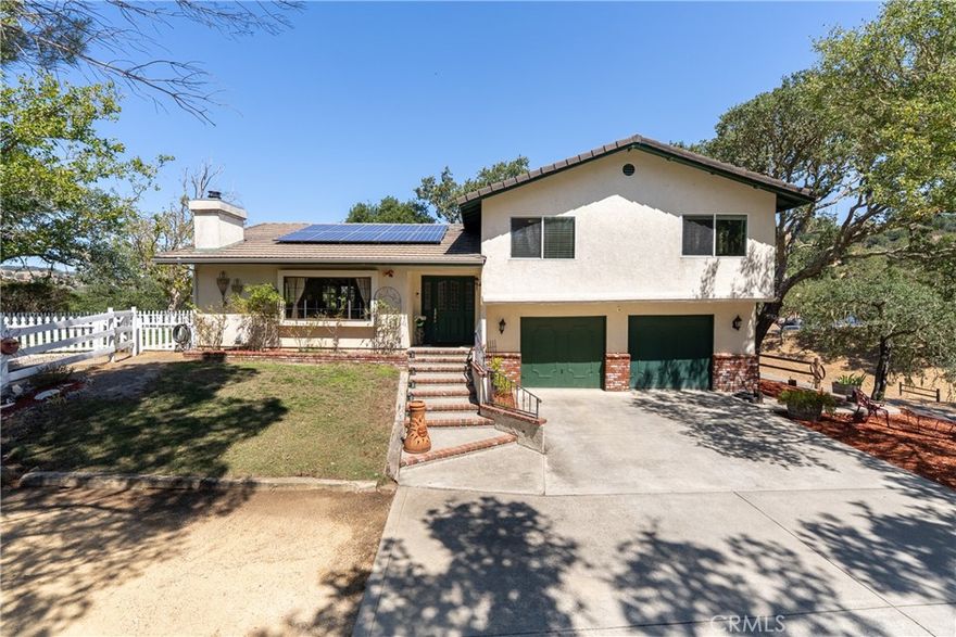 Welcome to this beautifully maintained 3 bedroom, 2.5 bathroom home offering 2014 sf of versatile living space, ideally situated in the highly desirable Paradise Valley community. This property offers the perfect blend of comfort, functionality and outdoor charm—ideal for those seeking space, serenity and a touch of country living. Step inside to a spacious main floor featuring an open-concept kitchen and living room with vaulted ceilings, laminate wood floors and a cozy wood burning fireplace. The kitchen and adjacent dining area are filled with natural light and both offer French doors that open to a charming outdoor retreat complete with grassy lawn, white picket fence, large deck and ample space to relax or entertain. Downstairs, a generous bonus room awaits—complete with a built-in bar and bathroom—perfect for a media room, guest suite or game space. Upstairs, you’ll find three sizable bedrooms, including a well-appointed primary suite with a private balcony overlooking the property, walk-in closet and an ensuite bathroom. Outside, the 1.47-acre lot is thoughtfully designed for both leisure and lifestyle. There’s RV parking near the home, and a multi-use area below—originally designed as an arena—now set up for horseshoes and gatherings. Horse lovers will appreciate the fully fenced pasture, plus a barn with tack room, making this property ideal for equestrian activities or 4H projects. Plus, its equipped with owned solar! Don’t miss this rare opportunity to enjoy the peace of country living with the convenience of nearby amenities. Whether you’re a horse enthusiast, hobby farmer or simply looking for a unique property with room to grow—this Paradise Valley gem is ready to welcome you home. Please review the Virtual Tour for additional information.