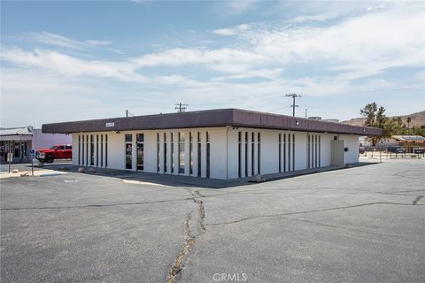Photo of 56165 Twentynine Palms Highway, Yucca Valley, CA 92284 (MLS # JT25228127)
