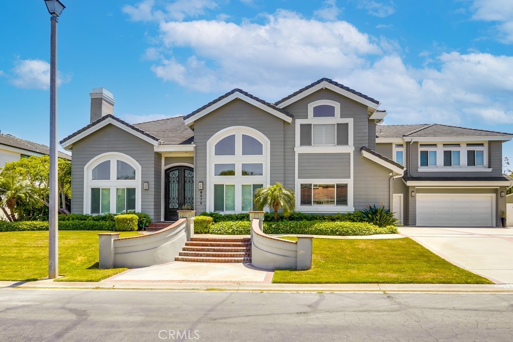 Elegant Estate in Prestigious Edward Hill, Huntington Beach. Welcome to your private sanctuary in the coveted Edward Hill neighborhood of Huntington Beach. Situated on an expansive 15,096 sq. ft. lot, this stately residence offers space, seclusion, and sophistication. Boasting 5,352 sq. ft. of refined living space, this home features 5 spacious bedrooms and 4.5 luxurious baths. The highlight of the home is a bonus/theater room equipped with acoustic tiles, a wet bar, automatic blackout blinds, and a state-of-the-art Lutron lighting system—perfect for movie nights or entertaining guests. Step out onto the deck and take the spiral staircase down to your resort-style backyard. Designed for seamless indoor-outdoor living, the open-concept kitchen includes Sub-Zero and Thermador appliances, a large center island, and opens to a bright family room with accordion sliding doors that lead to the pool area. Outside, enjoy a custom built-in BBQ with ample bar seating—ideal for large gatherings or relaxed evenings. The oversized 1,000 sq. ft. garage includes epoxy floors and built-in cabinets for exceptional storage. Smart home features abound, with a Sonos sound system throughout the house, garage, and backyard, Ring security cameras on all four sides, and a solar panel system for energy efficiency. This exceptional property offers the perfect blend of luxury, comfort, and modern convenience in one of Huntington Beach’s most desirable enclaves.