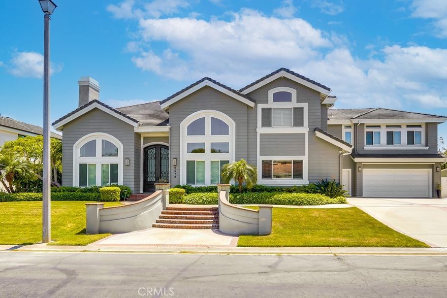 Come View this Elegant Estate in Prestigious Edward Hill, Huntington Beach.  Welcome to your private sanctuary in the coveted Edward Hill neighborhood of Huntington Beach. Situated on an expansive 15,096 sq. ft. lot, this stately residence offers space, seclusion, and sophistication.  Boasting 5,352 sq. ft. of refined living space, this home features 5 spacious bedrooms and 4.5 luxurious baths. The highlight of the home is a bonus/theater room equipped with acoustic tiles, a wet bar, automatic blackout blinds, and a state-of-the-art Lutron lighting system—perfect for movie nights or entertaining guests. Step out onto the deck and take the spiral staircase down to your resort-style backyard.  Designed for seamless indoor-outdoor living, the open-concept kitchen includes Sub-Zero and Thermador appliances, a large center island, and opens to a bright family room with accordion sliding doors that lead to the pool area. Outside, enjoy a custom built-in BBQ with ample bar seating—ideal for large gatherings or relaxed evenings.  The oversized 1,000 sq. ft. garage includes epoxy floors and built-in cabinets for exceptional storage. Smart home features abound, with a Sonos sound system throughout the house, garage, and backyard, Ring security cameras on all four sides, and a solar panel system for energy efficiency.  This exceptional property offers the perfect blend of luxury, comfort, and modern convenience in one of Huntington Beach’s most desirable enclaves.