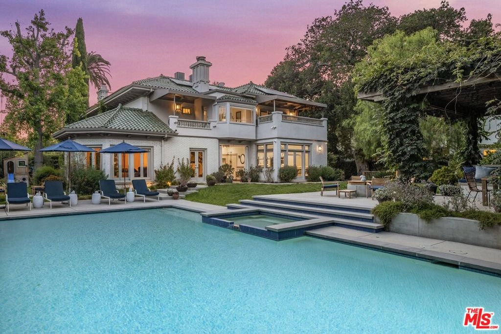 Welcome to 248 S Van Ness Ave, a gorgeous stately compound located in Los Angeles' coveted Hancock Park neighborhood. Beautifully sited on an almost 18,000 sq. ft. lot with a main house, pool and detached garage with a guest suite and office for a total of 5 bedrooms and 6 bathrooms. This property combines the best of traditional classic details and stylish updates for an easy relaxed elegance. Highlights include: meticulous designer touches by Sarah Shetter Design, art tile fireplaces, staircase window seat, primary suite balcony, vintage wood paneling, molding and plaster detailing, wisteria covered pool-side entertaining pavilion with outdoor kitchen and fire pit, chic outdoor pool bathroom, solar panels and side play yard. All of this half a mile from the delights of Larchmont Boulevard where you'll find shops, restaurants, Jeni's Ice Cream, Levain Bakery, coffee shops, yoga, pilates, massage, weekend Farmers Market, holiday festivals and more. Come check it out!