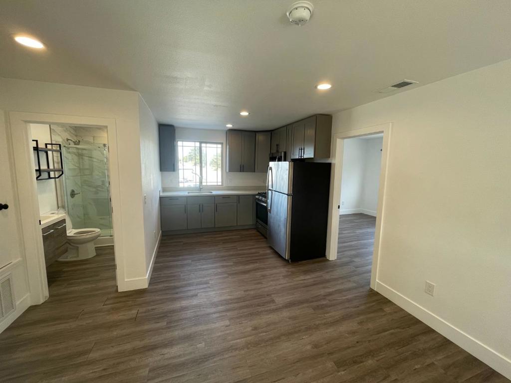 Step into this beautifully remodeled 3-bedroom, 1-bath apartment that blends stylish updates with comfortable living. Located in a quiet, well-maintained building, this bright and spacious unit features brand-new flooring, fresh paint, and contemporary finishes throughout. The dining area offers plenty of natural light and is perfect for both relaxing and entertaining. The updated kitchen boasts sleek countertops, stainless steel appliances, custom cabinetry ready for all your culinary adventures. Each of the three bedrooms is generously sized with ample closet space, while the newly renovated bathroom showcases elegant tilework, a modern vanity, and upgraded fixtures. Conveniently located near local shops, restaurants, and public transit, this apartment offers the perfect combination of comfort, style, and convenience.