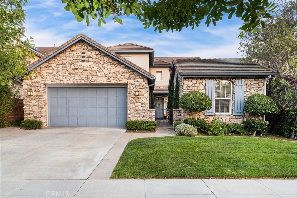 Welcome to 12 Ardennes, Ladera Ranch - a beautifully updated English-cottage style home in the heart of the community. This gracious residence offers 4 bedrooms, 2.5 baths, plus a separate casita, and is designed for both elegant entertaining and everyday family living. Step inside to discover warm, light French Oak flooring, designer paint, high baseboards, and recessed lighting throughout. The homes formal dining room features soaring two-story ceilings—perfect for hosting memorable dinner parties. The chef’s kitchen is fully remodeled and flows directly into the great room. It’s equipped with Thermador professional-grade appliances, white shaker cabinetry with updated hardware, custom backsplash, and Carrera marble countertops. A dreamy butler’s pantry with rustic wood shelving, additional cabinetry, and generous pantry space enhance its functionality. The main floor master suite impresses - featuring a completely remodeled master bathroom with a freestanding soaking tub, separate shower, and an oversized master closet. Upstairs, enjoy a large loft and sit-area, three guest bedrooms, a extra storage space, and a guest bath with dual sinks. Indoor-outdoor flow is effortless thanks to double French doors at both the front and back of the home. The private backyard is an entertainers’ delight under Southern California skies. Beyond the home, Ladera Ranch offers an unmatched community experience. Residents enjoy the newly updated Terramor Aquatic Park, skate park, sports fields, a dog park, multiple pools and clubhouses, playgrounds, and hiking trails. A calendar full of neighborhood social events makes it easy to connect and be part of this vibrant community. Located within walking distance to award-winning Ladera Ranch Elementary and Middle Schools, Founders Park, and scenic trails, this home is the perfect blend of charm, comfort, and lifestyle. Some photos of this property have been digitally enhanced/virtually staged for marketing purposes.
