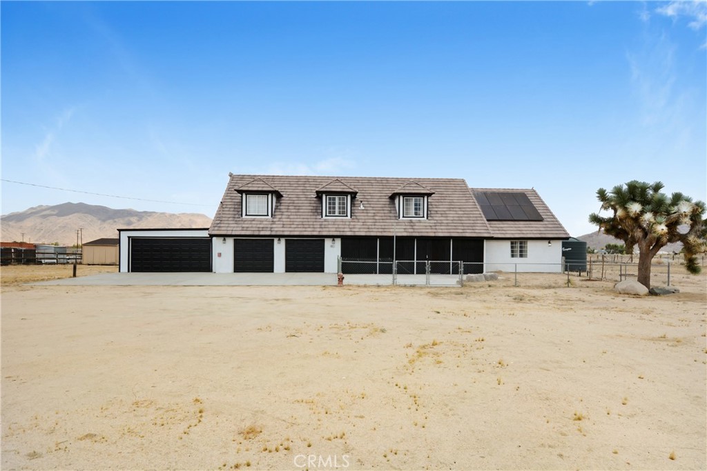 This remodeled rural retreat sits on a spacious 2+ acre lot with wide-open skies, stunning sunsets, mountain views and endless potential. The home has a bright, open layout featuring upgraded flooring downstairs, new carpet upstairs, fresh paint inside and out, a modern kitchen with new stainless steel appliances, plenty of cabinet space and a walk in pantry. The home has a total of 5 bedrooms and 4 baths with two ensuite bedrooms (one upstairs and one downstairs). There is plenty of room for multiple cars with 4 garage spaces and the new central air conditioning HVAC system keeps things comfortable, while the solar panels help cut energy costs. The large lot offers an outdoor storage shed and two large water storage tanks with room to expand, garden, entertain, or own animals. Tons of possibilities! Owners have the option of either Lucerne Valley or Apple Valley school district with approved waiver. Whether you’re looking for peaceful country living or space to make your vision a reality, 10015 High Road delivers!