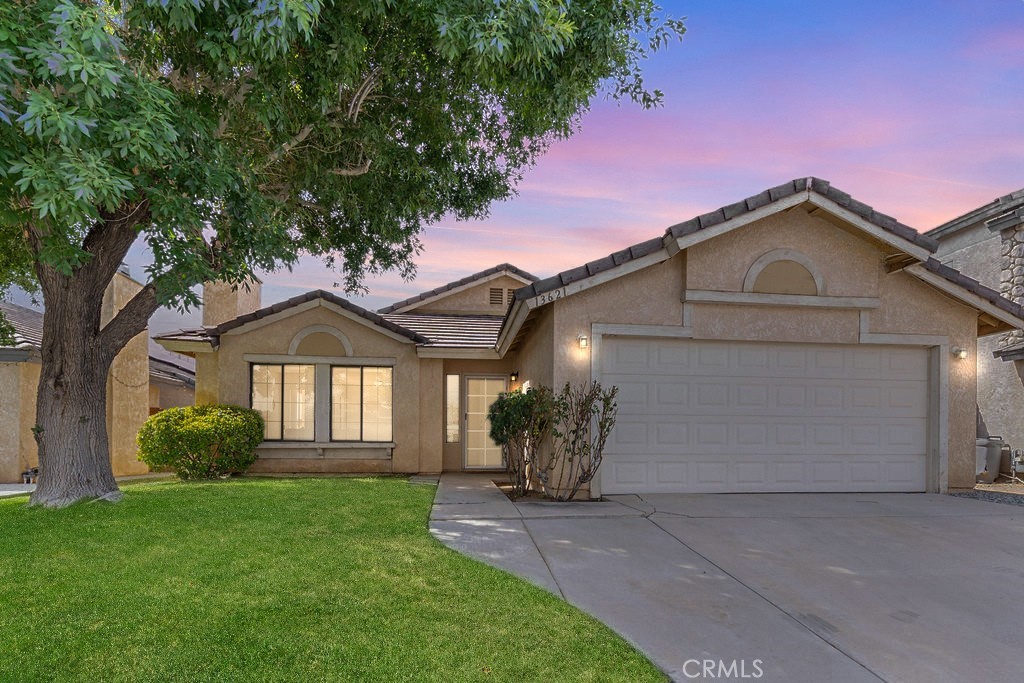 Welcome to this beautifully updated 3-bedroom, 2-bathroom home located in a highly desirable Victorville neighborhood. Offering 1,483 sq. ft. of living space, this home features a fresh interior paint throughout and an inviting open floor plan. The updated kitchen boasts brand-new appliances and modern countertops, perfect for both everyday living and entertaining. The spacious primary suite includes a sliding glass door to the backyard, a walk-in closet, and a dual-sink vanity. Cozy up by the gas fireplace in the living room or enjoy the seamless indoor-outdoor flow this home provides. With thoughtful updates and a prime location, this move-in ready home is a must-see!