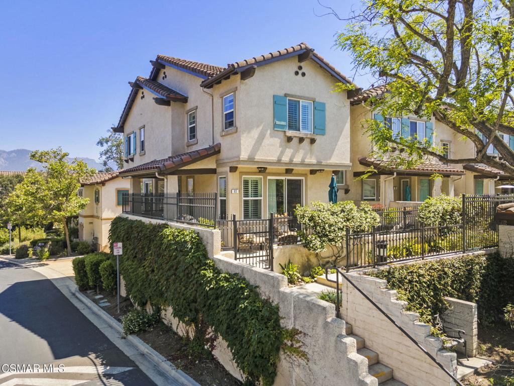 Sensational highly upgraded Dos Vientos Ranch Townhome in incredible location captures spectacular views of beautiful open space lands and Mount Boney! Located in upper Aldea, this home offers end-unit private location with extra windows throughout giving great natural light and all main rooms offer views! The beauty of the Santa Monica Mountains with alluring native landscapes and gardens abundantly surrounds this home. This end-unit is the largest model in the community with only twelve built in Aldea. Enter to an entertainer's front courtyard patio with splendid views that leads to a portico featuring additional outdoor living space. Inside, the open floorplan boasts loads of light and large windows, great layout, 9-foot ceilings, recessed lighting, and is ready for entertaining and relaxation. Impeccable Artisanship and Detail are evident in this home including traditional wood shutters, accent paint colors, custom 5-inch baseboards, and cabinet crown molding. Gorgeous Hand Scraped Maple Hardwood plank flooring is a centerpiece of the main living level and is featured in all rooms. To your right, the living room has ample space and is outfitted with a gas burning fireplace, built-in ceiling speakers, views, and 8-foot-high French sliding glass doors that lead out to the refreshing courtyard patio. The living room & other rooms enjoy cooling cross breezes. The dining room flanks the living room offering room for a large dining room set and has a cozy alcove with large windows affording beautiful views. The Chef's kitchen enjoys beautiful granite slab single ojee edge counters, newer Kitchen Aid appliances with a five-burner range and convection oven, Kohler and Grohe fixtures, classic white enamel style cabinetry, plenty of storage, comfortable breakfast bar, and opens to the family room. The spacious family room has direct access through the French sliding glass doors to a large view balcony. Upstairs is outfitted with plenty of linen cabinetry. The spacious Primary Bedroom Suite is privately situated offering several windows with views towards Conejo Mountain & open space lands, soaring 9-foot ceilings, and is cooled by a ceiling fan. Primary en-suite bath is roomy with a large walk-in & secondary closets, a walk-in shower & separate large soaking tub, tiled dual vanity, private water closet, and custom travertine floors. The secondary bedrooms both have captivating Boney Mountain & open space views and have lots of light. They are adjacent to the secondary full bathroom featuring tiled vanity, soaking tub-shower, and stylish travertine floors. A laundry room that's part of a large storage-workshop area includes a walk-in closet, built-ins, and is adjacent to a large 2-car garage, completes the first level. Aldea Dos Vientos Townhomes provides two magnificent pools, spas, and a clubhouse. The Via Katrina pool has breathtaking views of Boney Mountain at 2,825 feet above sea level. The grounds encompass awe-inspiring plant-tree palette consisting of several California & Southwest natives that offer year-round blooms. Several walking paseos give great connectivity throughout the complex and to the Dos Vientos Ranch community. Aldea has direct access to Sycamore Park & The Village Town Center's stores, restaurant & church. The planned community has direct access to amazing COSCA Trails that connect to the Dos Vientos Community Center & fields, several parks, the beach via Sycamore Canyon Fire Road, & multi-use trails that traverse to Rancho Sierra Vista, Point Mugu State Park, Thousand Oaks & Westlake Village. Sycamore Canyon Elementary & Middle School TK-8 is steps away--a 2023 California Distinguished School! Acclaimed International Baccalaureate World Schools & Blue Ribbon & California Distinguished School award-winning high schools are nearby. Centrally located close to exceptional eateries, theaters, fine shops, concert & performing arts venues, and amenities in Thousand Oaks, Westlake Village, Malibu & Ventura County.