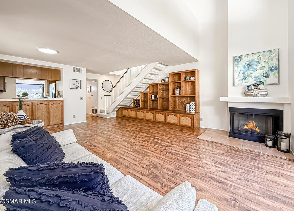Discover your own serene escape in the heart of Agoura Hills. This charming and spacious 1-bedroom, 2-bathroom townhome offers a graceful blend of comfort, style, and resort-like surroundings. Wake up to the gentle sound of light breezes and unwind in the evening on your private patio--surrounded by mature trees, and lush greenery. It's a rare, natural retreat right outside your door. Inside, the open layout feels inviting and airy boastingCATHEDRAL CEILINGS. Living room is spacious and bright with a fireplace for cozy evening. Dining area, and breakfast bar connecting seamlessly to the kitchen. NATURAL LIGHT pours through large windows and a sliding glass door, framing peaceful greenbelt views. Upstairs, the SPACIOUS loft-style bedroom is a relaxing haven with VAULTED ceilings, an EN-SUITE bath, and plenty of space to make your own. Additional comforts include Private unit laundry, central HVAC, wood look flooring. Lake View Villas is beautifully maintained, with a sparkling pool, spa, and meandering walking paths--it feels more like a weekend getaway than everyday living. All this, just moments from parks, award-winning schools, hiking trails, and wonderful local dining. Welcome Home!