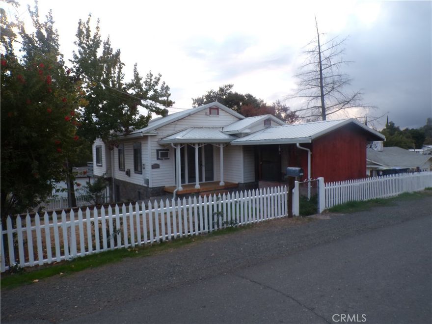 Located right in the heart of town! Close to dining, shopping, public parks, school and most importantly THE LAKE! The lake is just a very short walk from this home. This remodeled classic home is spacious and comfortable. Each room has new flooring, new paint a very fresh comfortable feel. There is a finished basement with a full bathroom, indoor laundry room, A covered BBQ/outdoor entertaining area, TONS of parking! two garages, two additional covered parking spots, a very good sized patio, also a large upper level deck! Home is on a double lot!