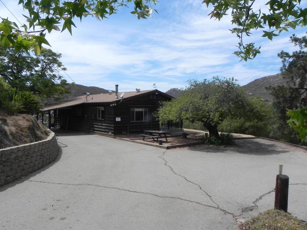 Opportunities can be yours on this 3 bedroom home sited on 1.45 acres. First time on the market in 54 years. Property boasts panoramic views of Harbison Canyon, large trees, room for RV, horses and garden areas. With two APN's that includes 4 subdivision parcels, this property screams for a future ADU or more. Make sure you check out the beautiful rockwork, block retaining walls and asphalted access roads throughout the property. Property has some differed maintenance and is in need of floor coverings, updated HVAC, deck repair and more.