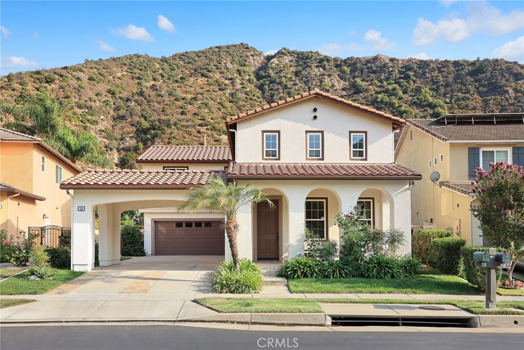 Welcome to your forever home in the prestigious Mountain Cove gated community of Azusa, offering 24-hour security service!
This beautifully maintained 2,484 sq. ft. residence features 3 spacious bedrooms, 2.5 bathrooms, and a 2-car garage with an extended driveway accommodating up to 6 additional cars.Inside, you’ll find a warm and inviting living room, a formal dining area, and a spacious family room with a large fireplace—perfect for gatherings. The open-concept kitchen boasts a generous updated center island, modern appliances, and direct access to the serene backyard with breathtaking mountain views.Upstairs, the luxurious primary suite provides a peaceful retreat, while two additional bedrooms, a guest bath with dual sinks, and a versatile loft ideal for a home office or study complete the thoughtful layout.The community offers resort-style amenities, including a sparkling pool, spa, playground, clubhouse, and 24-hour gated security—all just minutes from schools, parks, and shopping.Don’t miss this rare opportunity to own a beautiful home in the highly sought-after Mountain Cove community!