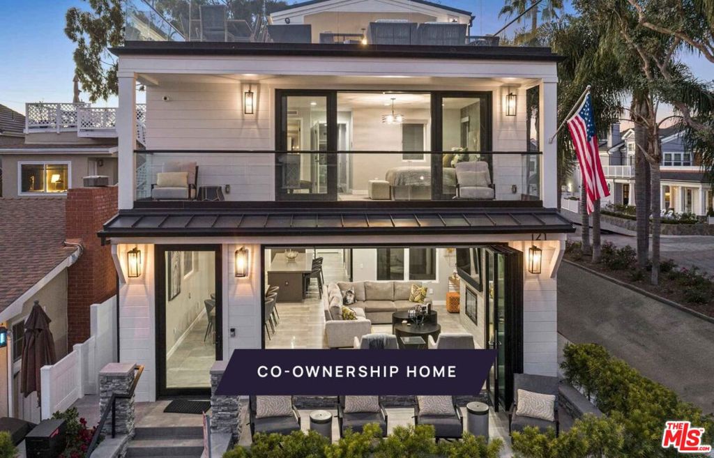 New Co-Ownership Opportunity: Own one-eighth of this turnkey home, professionally managed by Pacaso. The best of Newport Beach living is at your doorstep in this 4-bedroom, 5-bathroom home on Balboa Island's quiet west side. Glass walls in this contemporary Cape Cod open up the first-floor great room to the front patio, perfect for watching passersby a favorite pastime on this friendly island.This home is made for entertaining, thanks to an open-plan main floor with a fireplace, dining area and a gourmet kitchen that opens to a spacious patio with a built-in barbecue. But it's the third-floor rooftop that takes entertaining to new heights. It includes a covered outdoor kitchen and dining area, and an open patio that features a jacuzzi, fire pit and panoramic views of the bay, island and sunset.Take the stairs or the custom artisan glass elevator to four bedrooms on the second floor. The spacious primary has sliding doors to a private balcony and luxurious en suite bathroom with soaking tub. The home comes fully furnished and professionally decorated.