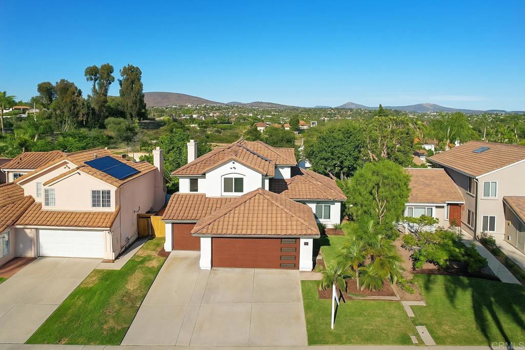 Recently refreshed with brand new luxury vinyl plank flooring and fresh interior and exterior paint, this beautifully upgraded 4-bedroom, 3-bath home is tucked away on a quiet double cul-de-sac in the highly sought-after Santa Fe Ridge community of Carlsbad. This well-maintained residence offers peace of mind and modern comfort with owned solar, central air and heating, and an oversized 3-car garage with extra depth for added storage or workspace. The bathrooms have all been remodeled, and the kitchen shines with granite countertops and updated finishes. The entire home has been re-piped with copper plumbing for lasting durability. A new roof was installed in 2015, and a security system adds an extra layer of protection. Ideally located within top-rated schools in the Encinitas and San Dieguito districts, this home also offers easy access to local parks, shopping centers, dining, beaches, golf courses, and all the best of North County living.