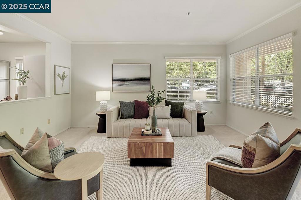 Beautiful Huntington Condo in the Waterford – First Floor Location! This inviting 2-bedroom, 1.5-bath home offers comfort, convenience, and style in a desirable first-floor setting. The spacious floor plan features a large living room with dual-pane windows and direct access to a private wraparound patio—perfect for relaxing or entertaining. A separate dining area complements the bright kitchen, complete with freshly painted cabinets, microwave/oven combo, built-in stovetop, trash compactor, and a window that fills the space with natural light. The versatile guest bedroom is ideal as a cozy den or second bedroom. It is adjacent to the guest bath, which includes newly painted cabinets, a storage closet, and a convenient stack washer/dryer. The large primary suite is light and airy with dual-pane windows, while the upgraded primary bath offers a shower-over-tub with upgraded tile, extra grab bars, and a separate vanity with freshly painted cabinets. Additional highlights include a nearby carport, storage closet, and approximately 1,141 square feet of living space. Waterford homeowners enjoy the convenience of one meal per day and weekly housekeeping, adding comfort and ease to everyday living.