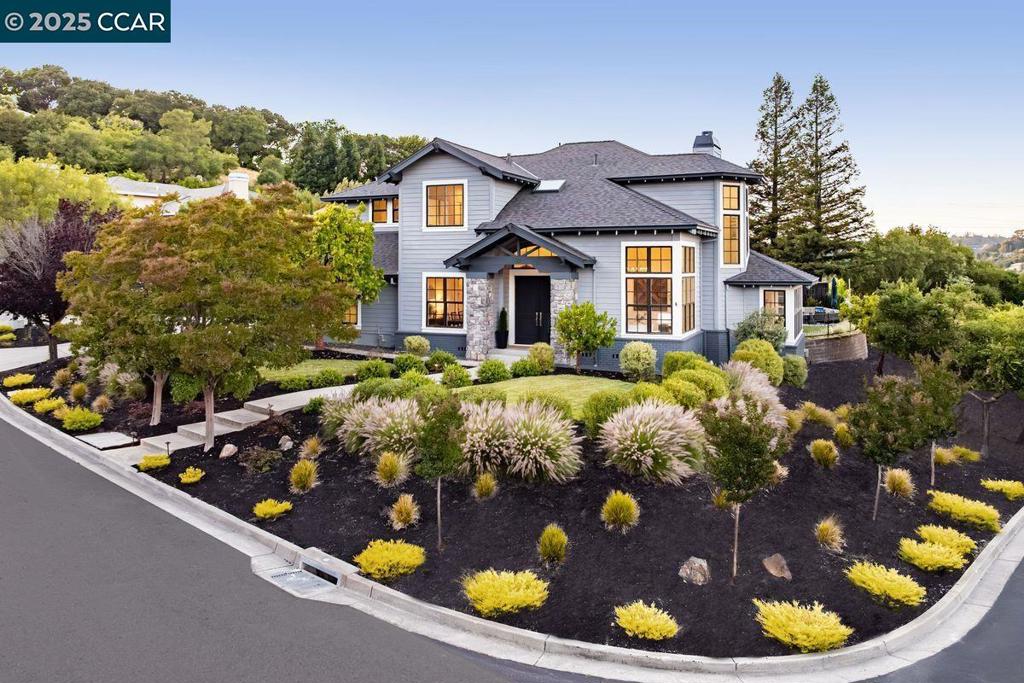 This home offers indoor-outdoor living midway between Orinda’s downtown and Orinda Intermediate School/Miramonte High. Enter the foyer under a 20-foot ceiling. French doors beckon one to the new, low-maintenance entertainment area outside. A pergola covers the outdoor dining area. Adjoining that is the elite grill, water feature and firepit. Inside, the kitchen features top appliances, silestone countertops and a breakfast nook. Alongside is a stylish lounge, and white oak floors grace the premises. The dining room, with ample seating, adjoins the kitchen. Distinctive light fixtures and elevated ceilings are found throughout. The 4 bedrooms span both floors. The principal suite is at the top of the stairs, featuring recessed lighting; a large walk-in closet; and an en-suite bath, with tub, oversized shower and dual sinks. Two other bedrooms, with a jack-and-jill bath, also are upstairs. The laundry area sits among the upstairs bedrooms. The 4th bedroom, downstairs, is a perfect guest room, with an en-suite bath and its own entrance to the outside. Manicured plants and trees surround the grounds. The garage (with EV charger) and circular driveway provide ample parking. Kids have easy access to buses to award-winning schools. Nearby Moraga Road leads quickly to the 24 freeway.