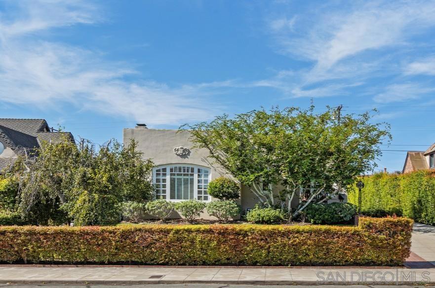 This vintage home exudes the charm and character of Loma Portal and is ready for your personal touches. The spacious living room features large windows that bring abundant light and the beautifully landscaped outdoors inside. Formal dining room, efficient kitchen featuring stainless steel appliances and adjacent sunny breakfast nook. Three generous bedrooms, one with ensuite. Pegged hardwood floors add warmth throughout, and the detached two-car garage includes a laundry area. The charming brick patio, surrounded by lush greenery, is perfect for relaxing. Enjoy the essence of the Loma Portal neighborhood with its community park, close proximity to Liberty Station, and walking distance to Loma Portal Elementary and Point Loma High.