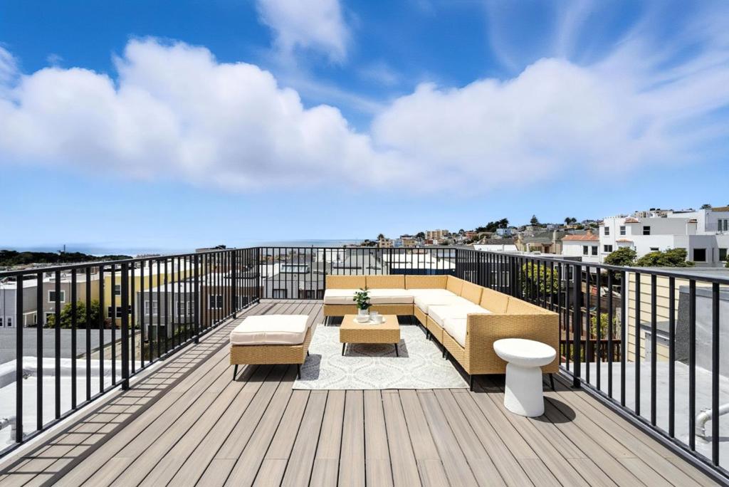 Discover the perfect blend of style, and versatility in this beautifully updated 5-bedroom, 4-bathroom home offering 2,345 sq ft of living space. Ideally designed for multigenerational living or income potential, the home features a flexible layout with 3 beds and 2 baths upstairs, and a separate 2-bed, 2-bath suite on the lower level with its own street-level entrance. Step inside to find a spacious living room illuminated by sleek recessed lighting, and elegant hardwood floors that flow throughout. The kitchen is equipped with stainless steel appliances, a stylish island counter, quartz countertops, and crisp white cabinetry offering abundant storage. Retreat to the primary ensuite featuring a dual-sink vanity and a stall shower, providing a private oasis of comfort. Atop it all, a private rooftop deck offers sweeping views of Ocean Beach and Golden Gate Park. Located just steps from Balboa Street, youll enjoy easy access to beaches, parks, schools and neighborhood favorites like The Laundromat and Devils Teeth Baking Company. Commuting is a breeze with nearby access to the 38/38R bus lines, connecting you quickly to downtown San Francisco. Don't miss this rare opportunity to own a home that offers flexibility, comfort, and an unbeatable location.