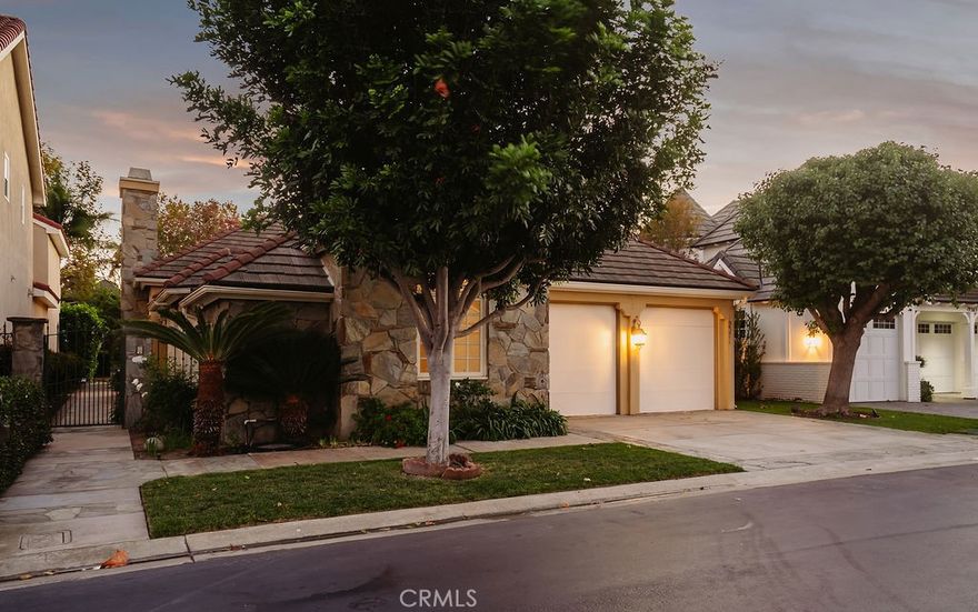 Welcome to the exquisite Estate Series gem in the prestigious, guard-gated community of SeaCliff on the Greens! This amazing single-story home has a phenomenal floor plan crafted to create a warm and inviting atmosphere. Step into the chef's paradise, which features a convenient breakfast bar and a bright breakfast nook with French doors leading to the backyard. Adjacent to the kitchen, the inviting family room offers a cozy fireplace, wet bar, plantation shutters, and additional access to the private backyard with a built-in BBQ, ideal for entertaining. Retreat to the luxurious primary suite boasting a cozy fireplace and more natural light with courtyard access, spacious dual walk-in closets, and a spa-like en-suite bathroom with dual sinks, a makeup vanity, a soaking tub, and a separate shower. The two secondary rooms are generous in size with a "Jack and Jill" bathroom with dual sinks and a combined shower and tub. The enchanting 19371 Woodlands also offers a laundry room with direct access to the 2-car attached garage, custom built-ins, and a large attic for extra storage. Ideally situated, this home is within biking or walking distance of the sun-kissed sands of the Pacific Ocean, the Huntington Club Golf Course for golf and tennis, delightful shopping, acclaimed schools, and the renowned dining and entertainment of Downtown Huntington Beach, complete with its iconic pier. *some photos staged to showcase this beautiful home