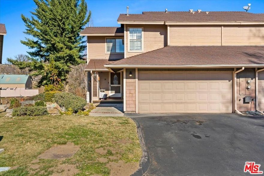 Comfort and Style Welcome to this beautifully designed  home nestled in the heart of Tehachapi, CA. Offering 1,567 square feet of thoughtfully laid-out living space, this home perfectly blends comfort, style, and functionality. The open floor plan ensures seamless living, while stylish finishes throughout create a warm, welcoming atmosphere.Upon entering, you'll be greeted by a spacious living room with a cozy fireplace  the ideal spot for both relaxation and entertaining. The kitchen flows effortlessly into the dining area, showcasing sleek oak cabinetry, beautiful granite countertops, and modern appliances, including a charming farm sink. New waterproof vinyl flooring gives the home an elegant touch, while plush carpeting in the bedrooms adds comfort and warmth. Large windows and a sliding glass door flood the space with natural light, creating an inviting, bright, and airy atmosphere in both the living room and kitchen.Upstairs, you'll discover a versatile loft area, perfect for a home office, reading nook, or additional living space. The beautiful primary bedroom offers a true retreat, featuring a walk-in closet and a stylish en-suite bathroom that ensures both privacy and luxury. Thoughtfully Designed Living space with Cozy FireplaceModern Kitchen with Oak Cabinetry, Granite Countertops, and Farm Sink, and Plush Carpeting in Bedrooms. Bright, Airy Living Areas with Large Windows.   Primary Bedroom with Walk-In Closet and En-Suite BathroomThis home offers a perfect blend of modern amenities and cozy charm, making it a rare find in Tehachapi. Don't miss your chance to make this move-in-ready beauty your own! HOA covers TRASH and Landscaping.