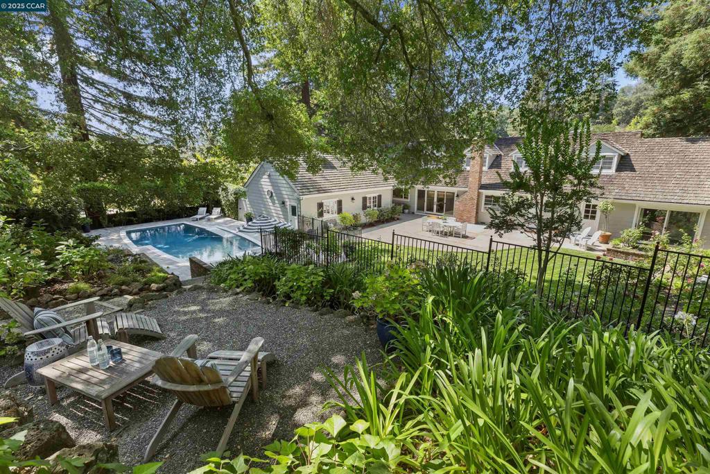 Storybook home on Amber Valley! Meticulously maintained throughout the years, this cherished home is ready for it's next chapter. Amber Valley lives like a single story providing all the primary living spaces on the main level, while the upper level adds versatility with a spacious 2nd family room, bedroom and full bath, perfect for guests or an au pair. Seamless indoor-outdoor living unfolds onto beautifully manicured grounds, offering a tranquil private setting perfect for lively gatherings or a quiet morning coffee. A timeless home in the perfect location, this is the one you've been waiting for! Open Tuesday 10AM-1PM