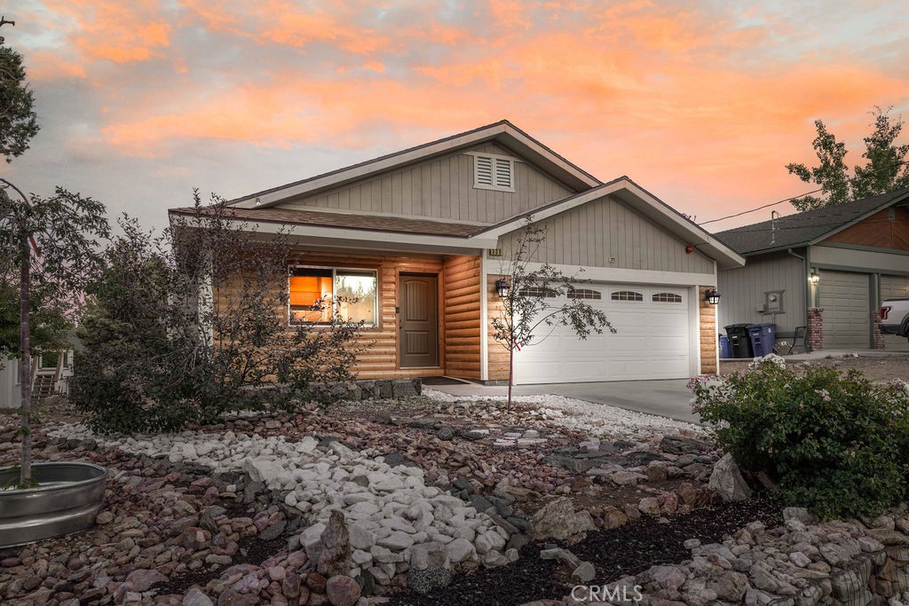 Welcome to this impressive newer ranch-style home featuring 3 bedrooms and 2 bathrooms with a bright, open layout, perfect for everyday living or entertaining. The great room showcases stunning wood-lined vaulted ceilings and a private, spacious dining area. Additional highlights include granite countertops in both the kitchen and baths, laminate-style flooring throughout, and a cozy gas fireplace that blends modern comfort with mountain charm. The spacious, partially landscaped lot offers room to relax, complete with a hot tub for soaking in the fresh mountain air. With a 2-car attached garage and a quiet yet convenient Big Bear City location, this home is ideal as a full-time residence or a peaceful part-time retreat!