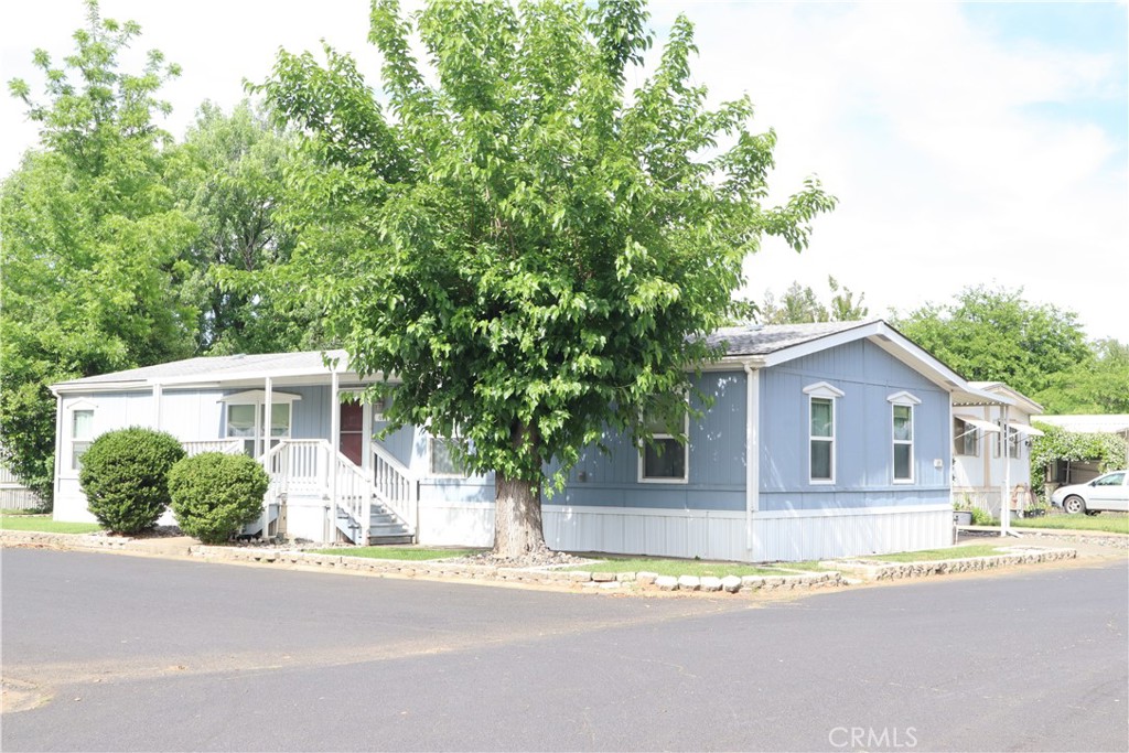 Absolutely stunning Manufactured Home! The style of this home is designed for comfort, quality, and design. You will enter the home into the formal living room, and your eye will be drawn to the high end quality. The home allows you to decorate with large furnishings for almost any lifestyle. Open floor plan flows naturally into the dining and opulent kitchen with nice counter space and cabinets. The large breakfast bar is open to the dining room and oversized family room attached. There are three nice sized bedrooms, with ceiling fans in every room to circulate the central heating and air! The details provide for easy living! The large primary bedroom has a walk in closet and attached primary bath with soaking tub, separate stall shower, and dual sinks. The homeowner has professionally maintained landscaping, covered carport parking, exterior storage shed, and matured trees. This home is located in the back of an established manufactured home park! You'll love the location for privacy. Enjoy the community pool, barbecue area, and additional laundry facilities! Make this home yours today by calling your realtor, and take that private tour!