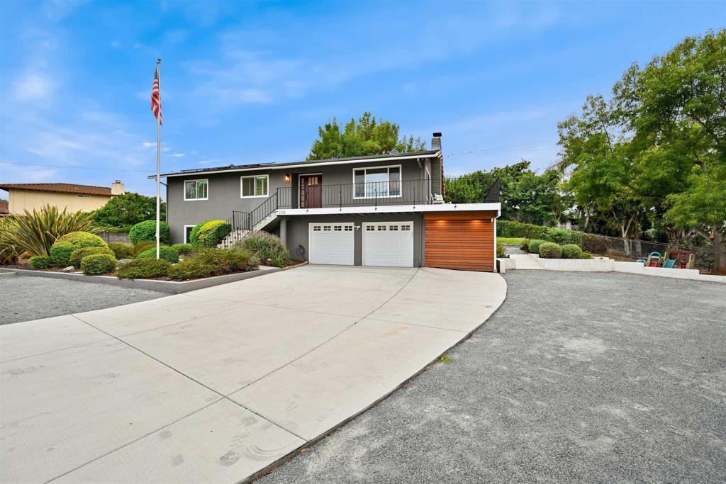 Beautifully Remodeled Vista Home on Half-Acre Lot! This stunning Vista residence offers modern style, spacious living, and incredible outdoor space on a generous half-acre lot. Inside, the open floor plan dazzles with abundant natural light, stylish flooring, recessed lighting, and eye-catching fixtures throughout. A natural-edge mantel highlights the sleek modern fireplace, creating a warm and elegant focal point. The chef’s kitchen is a showstopper, featuring quartz countertops with decorative backsplash, crisp white cabinetry, stainless steel appliances, and an eat-at center island—perfect for gatherings. Both bathrooms have been fully remodeled with today’s finishes, while an interior laundry area adds everyday convenience. Dual-pane windows enhance energy efficiency alongside solar panels installed in 2014. The oversized two-car garage offers plenty of room for vehicles, RVs, and all your toys. As an added bonus there is an additional storage space next to the garage that will keep all of your items organized. Outdoors, a wrap-around deck invites you to relax and take in breathtaking sunsets, while the expansive yard provides endless opportunities for stargazing while enjoying the built-in firepit, plenty of grass for play, gardening, or entertaining. A junior ADU expands your possibilities with plenty of room to suit your needs plus a modern full bathroom. A new roof was installed in 2021 and new water heater in 2024, providing years of enjoyment. With its blend of modern upgrades, thoughtful details, and usable space, this property is truly a must-see!