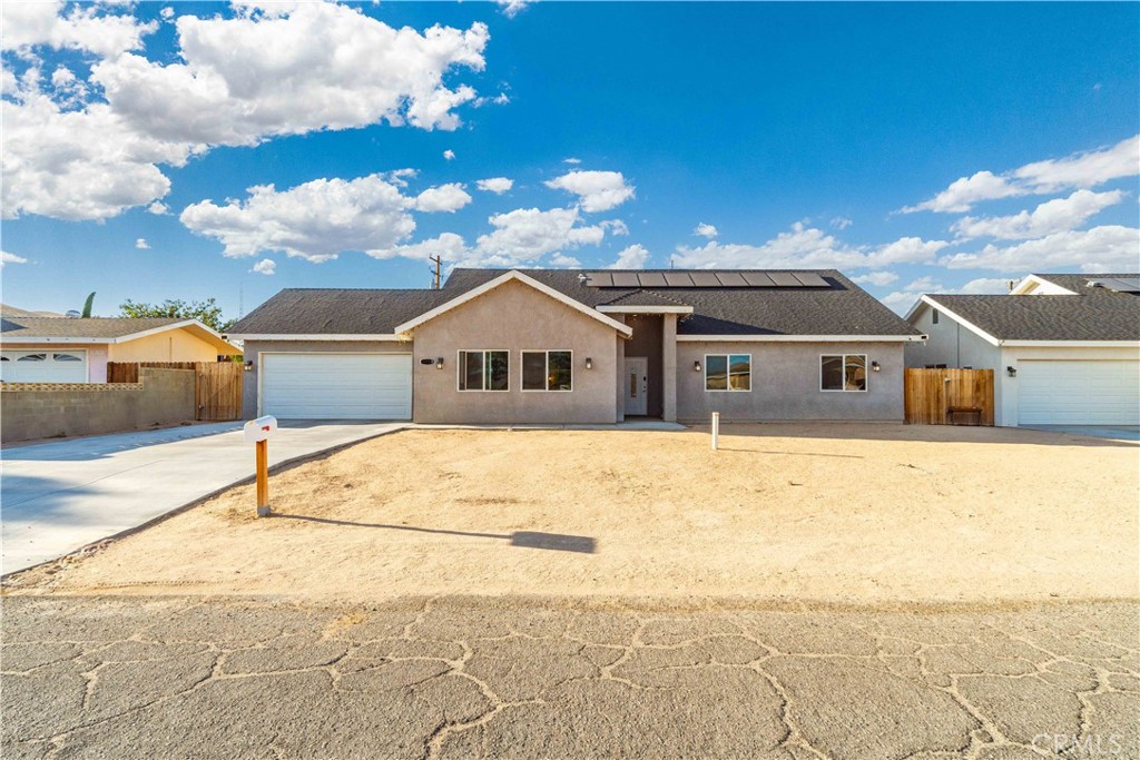 Great Opportunity in California City. a well-maintained home on a large, flat lot with tons of potential. Enjoy an open layout, spacious bedrooms, and plenty of outdoor space for RV parking or future expansion. Located on a quiet street with easy access to local amenities. Perfect as a starter home, or desert retreat! This property comes with paid-off solar, offering energy savings and efficiency from day one. The lot is ideal for gardening, outdoor entertaining, or even building an ADU. Inside, the natural lighting and clean layout create a warm and welcoming feel. You have the freedom to make it your own. Don't miss your chance to own in the growing California City area!