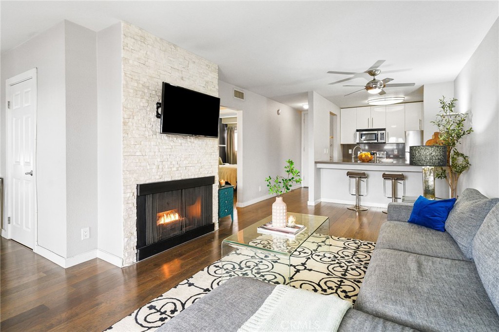 Welcome to The Rob Clark – Where Sophistication Meets Style in the Heart of West Hollywood. This impeccably curated 1BD/1BA with den condo presents a rare opportunity to lease a chic, turnkey residence in one of Los Angeles’ most coveted locations—at the intersection of 3rd and Clark, just steps from Beverly Hills, The Ivy, Cedars-Sinai, and Robertson’s world-renowned boutiques and restaurants. Designed for the discerning buyer, the open-concept layout is ideal for both effortless entertaining and relaxing in style, featuring stunning hickory or light oak hardwood floors, a cozy fireplace, and a private balcony. The gourmet kitchen is a chef’s delight with Caesar stone countertops, sleek stainless steel appliances, and a breakfast bar that seamlessly connects to the dining and living areas. A modern in-unit washer/dryer offer convenience and comfort. The tranquil bedroom suite includes a generous walk-in closet—perfect for the fashion lover—while the versatile den is ideal as a home office, guest nook, or creative space. Enjoy a lifestyle of luxury with resort-style amenities: a sparkling heated pool, stylish BBQ courtyard, modern fitness center, and beautifully maintained common areas—all with a remarkably low HOA. Recent building upgrades include refreshed elevators and pool areas, ensuring peace of mind and elevated living. This home offers unmatched location, design, and value, experience chic urban living at The Rob Clark—where elegance, location, and lifestyle converge!