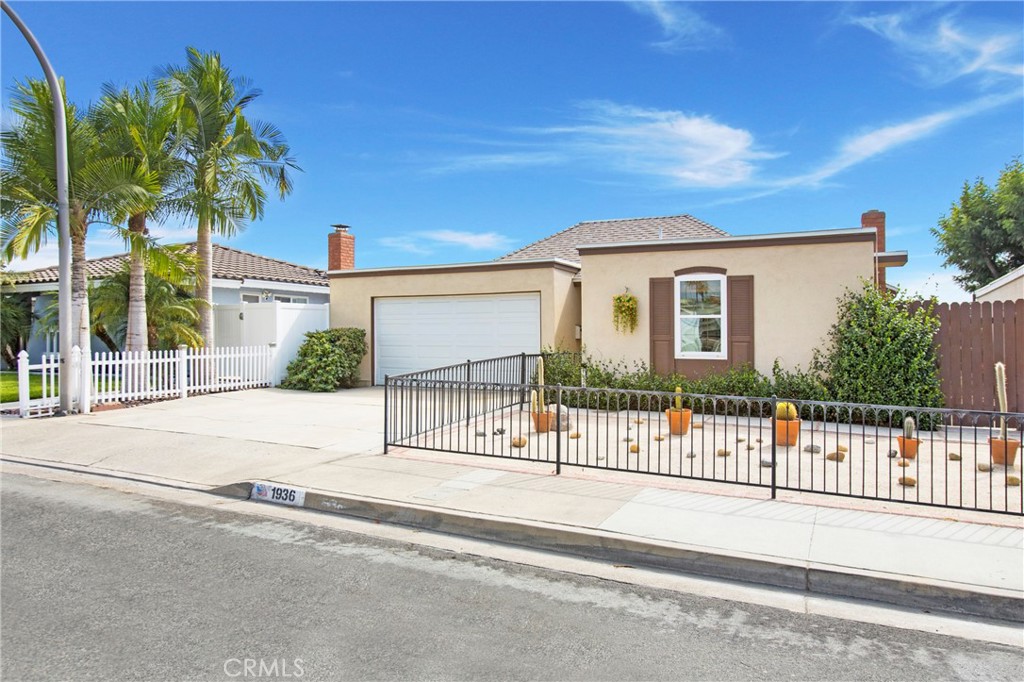 BEAUTIFUL BREA SINGLE-STORY HOME WITH A UNIQUE FLOORPLAN, NEW ROOF, & DESERT-STYLE BACKYARD! Step into this inviting single-story home, where comfort and thoughtful design come together. Offering 3 spacious bedrooms and 2 bathrooms, the layout is both functional and private. The master suite feels like its own retreat, complete with an ensuite bathroom, two closets—including a large one with built-in shelving—and smart separation from the secondary bedrooms, providing peace, privacy, and quiet. The hallway bathroom is freshly updated with a new shower and toilet, granite countertops, and a vanity area. Built-in cabinetry throughout the home ensures plenty of storage, while new carpet in the bedrooms adds a soft finishing touch. The living room welcomes you with the warmth of a gas fireplace, soft natural light spilling in through multiple sliding glass doors, and the sleek look of new laminate flooring. Recessed lighting and ceiling fans add comfort and style to this bright and airy space. In the kitchen, rich wood cabinetry pairs beautifully with granite countertops and a barstool counter, perfect for morning coffee or casual meals. A generous pantry offers plenty of storage and the kitchen flows seamlessly into the family room/den, making it the true heart of the home. Through the sliding glass doors, your backyard oasis awaits. A partially covered patio offers shade on sunny afternoons, while the low-maintenance desert-style landscaping creates a peaceful backdrop for gatherings or quiet evenings. A mature lemon tree adds both charm and a touch of homegrown flavor. Practicality meets comfort with direct garage access to the laundry area and a spacious two-car garage, freshly finished with new drywall and a built-in workspace—perfect for projects or storage. Perfectly positioned in the Fullerton Joint Union School District, this home is just a short stroll to the highly-ranked and award-winning Sonora High School recognized for its college prep and academic performance. Centrally located between Brea and La Habra and minutes from neighborhood coffee shops, local markets, museums, and dining, you’ll enjoy the best of both communities. This home blends comfort, location, and lifestyle—schedule your private tour today.