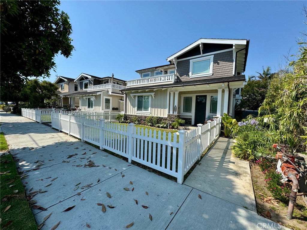You will love the floor plan and design on this craftsman town home. Two Bedrooms (laminated wood floors) on the first floor with sliding door leading to large private back yard (Double the size of your ordinary town home). Also on the first floor is a full bath, laundry, extra deep two car garage with extra room for bikes or surf boards, and two parking spaces shared with the other 3 units for loading & unloading only. Master bedroom has vaulted ceilings, laminated wood floors, see-through fireplace, 2 closets (his and hers) & skylights. Open living area has wood floors, vaulted ceilings and large deck with natural gas for BBQ off of the living area. Kitchen has granite counters and built-in stainless steel appliances, including a fridge and a built-in coffee maker. Finishing touches on this craftsman home include, wood floors on stairs and living area, laminated wood floors in bedrooms, AC, casings around windows, oversized baseboards and crown moldings, high ceilings, and vaulted ceilings on the second floor. Great location! Walker’s Paradise with 93 Walk score (10 min walk) to Hermosa Beach Strand, a market, restaurants, schools, a dog park, and much more. All units were painted on exterior . Shows like Model Home Inside and Out. Must see!
