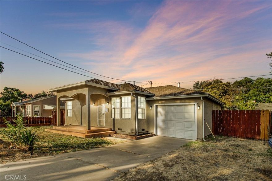 Welcome to 136 Village Rd, an absolutely charming 2-bed, 1-bath home located on a quiet, private street in the highly sought-after La Loma neighborhood of Modesto. This tastefully updated home offers a rare mix of timeless character and thoughtful upgrades throughout. A newly installed 50-year presidential roof not only adds stunning curb appeal but ensures lasting value and peace of mind. From the moment you step onto the fully covered front porch - with stamped concrete, classic red brick accents, and black bark flower beds - you’ll feel the warm, inviting energy of this special home. Inside, the original oak hardwood floors have been beautifully refinished using Rubio Topcoat - a safe, zero-VOC finish known for its rich matte look and durability. The living room is filled with natural light from large windows and is complemented by recessed lighting and a stylish ceiling fan. The remodeled kitchen features new white cabinetry, countertops, recessed lighting, and views of the spacious backyard. Both bedrooms are generously sized with relaxing gray tones and plenty of light. The bathroom has been fully updated with new plumbing, a full tile shower, durable tile floors, a pedestal sink, and stained crown molding. The deep one-car garage adds valuable storage and includes a laundry area with a large utility sink. A brand new water heater ensures long hot showers, while the spacious backyard offers endless potential - RV parking, boat storage, a future pool... The possibilities are endless! This home includes numerous upgrades: new HVAC and ducting, dual-pane windows, attic insulation, shower plumbing, and more. If you’re looking for a beautiful, move-in-ready home with all the major updates complete, in one of Modesto’s most charming neighborhoods, this is it! Welcome Home!!!